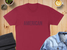 Load image into Gallery viewer, Maroon t-shirt with "AMERICAN" printed in navy blue letters.