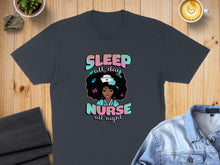 Load image into Gallery viewer, Dark t-shirt with nurse graphic, "Sleep all day, Nurse all night" text.