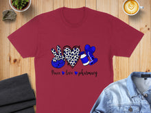 Load image into Gallery viewer, Burgundy t-shirt with blue leopard print peace sign, pills, and "Peace love pharmacy" text.
