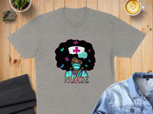 Load image into Gallery viewer, Gray t-shirt with a Black nurse illustration, wearing a mask and stethoscope, butterflies in hair.
