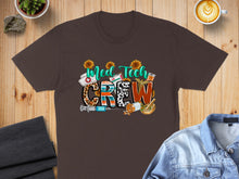Load image into Gallery viewer, Brown t-shirt with "Med Tech Crew" text, stethoscope, syringe, and medical icons.