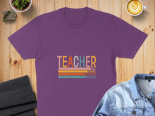 Load image into Gallery viewer, Purple t-shirt with "TEACHER" text and colorful stripes.