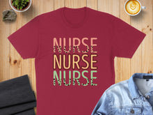 Load image into Gallery viewer, Burgundy t-shirt with "NURSE NURSE NURSE" text in colorful, patterned letters.