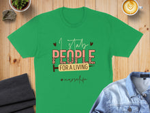 Load image into Gallery viewer, Green t-shirt with "I stab people for a living #nurselife" text and a syringe graphic.