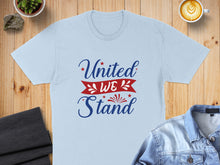 Load image into Gallery viewer, Light blue t-shirt with "United We Stand" text in red and blue.