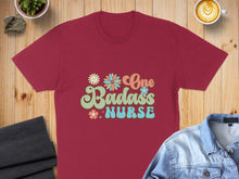 Load image into Gallery viewer, Burgundy t-shirt with "One Badass Nurse" text and floral design.
