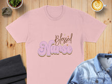 Load image into Gallery viewer, Pink t-shirt with "Blessed Nurse" in groovy purple and yellow lettering.