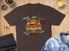 Load image into Gallery viewer, Brown t-shirt with "DAD" in a crown and words like "Strong Hero Protector Black Leader".