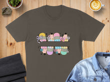 Load image into Gallery viewer, T-shirt with colorful pencil characters wearing bows and holding flowers.