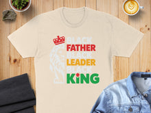 Load image into Gallery viewer, Black Father Leader King text with lion graphic on a cream t-shirt.