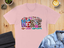 Load image into Gallery viewer, Pink t-shirt with "Nurse" graphic featuring coffee, scrubs, and rubber gloves.