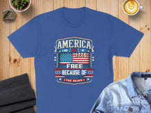 Load image into Gallery viewer, Blue t-shirt with "AMERICA LAND OF THE FREE BECAUSE OF THE BRAVE 1776" design.