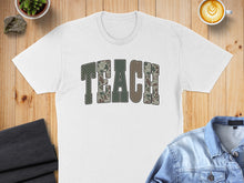 Load image into Gallery viewer, White t-shirt with "TEACH" in camouflage block letters.