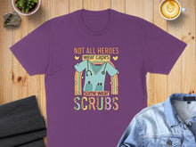Load image into Gallery viewer, Purple t-shirt with rainbow and scrubs graphic and text.