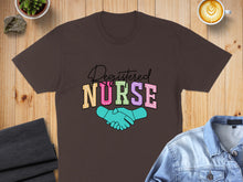 Load image into Gallery viewer, Registered Nurse text with shaking hands graphic on brown t-shirt.