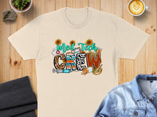 Load image into Gallery viewer, Beige t-shirt with "MED TECH CREW" graphic, featuring medical symbols and sunflowers.