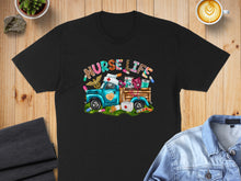 Load image into Gallery viewer, Black t-shirt featuring a cartoon blue pickup truck overflowing with medical supplies.