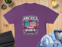 Load image into Gallery viewer, Purple t-shirt with "America Land of the Free Because of the Brave 1776" design.