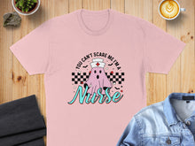 Load image into Gallery viewer, Pink t-shirt with ghost saying "You can't scare me I'm a Nurse".