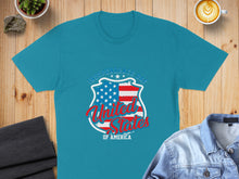 Load image into Gallery viewer, Blue t-shirt with red, white, and blue shield graphic and "Independence Day of America" text.