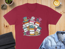 Load image into Gallery viewer, T-shirt graphic with cartoon medicine bottles and hats labeled with drug names.