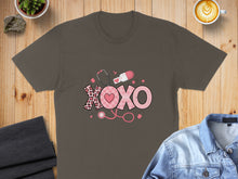 Load image into Gallery viewer, Dark grey t-shirt with pink "XOXO" design featuring medical symbols.