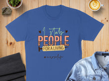 Load image into Gallery viewer, Blue t-shirt with "I stab people for a living" and "#nurselife".
