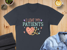 Load image into Gallery viewer, Dark t-shirt with "I Love My Patients" text, heart, and stethoscope graphic.