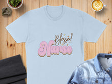 Load image into Gallery viewer, Light blue t-shirt with "Blessed Nurse" in retro pink and gold font.