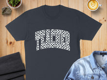 Load image into Gallery viewer, Dark gray t-shirt with "TEACHER" in a checkerboard design.