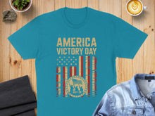 Load image into Gallery viewer, Teal t-shirt with distressed American flag and "America Victory Day May 08" text.