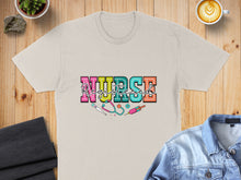 Load image into Gallery viewer, Cream t-shirt with "Registered Nurse" in colorful block letters and medical icons.