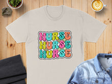 Load image into Gallery viewer, T-shirt with colorful "Nurse" text and floral accents.