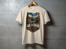 Load image into Gallery viewer, Cream t-shirt with "No Roads No Noise Just Radio" graphic and mountain scene.