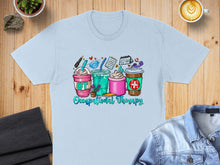 Load image into Gallery viewer, Occupational therapy themed t-shirt with coffee cups and art supplies.