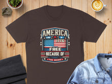 Load image into Gallery viewer, T-shirt with "America, Land of the Free Because of the Brave" text and American flag graphic.