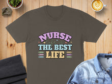 Load image into Gallery viewer, Dark brown t-shirt with "Nurse is the best life" text and syringe graphics.