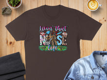 Load image into Gallery viewer, Brown t-shirt with "Lovin' that nurse life" text and medical graphics.