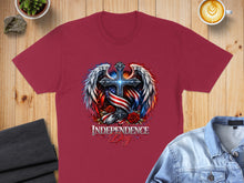 Load image into Gallery viewer, Maroon t-shirt with a patriotic cross and wings design, reading "Independence Day".