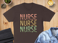 Load image into Gallery viewer, Brown t-shirt with "NURSE NURSE NURSE" text in pink, yellow, and green.
