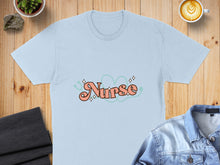 Load image into Gallery viewer, Light blue t-shirt with "Nurse" text in pink and green retro font.