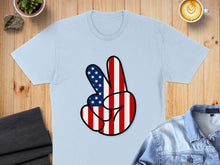 Load image into Gallery viewer, Light blue t-shirt with a hand making a peace sign with American flag pattern.