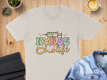 Load image into Gallery viewer, Cream t-shirt with "Nurse Life" text featuring a syringe.