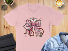 Load image into Gallery viewer, Pink t-shirt with a stethoscope and nurse's cap adorned with XOXO pattern.
