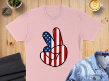 Load image into Gallery viewer, Pink t-shirt with peace sign made of US flag pattern.