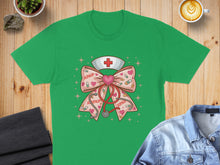 Load image into Gallery viewer, Green t-shirt with a pink bow, stethoscope, and nurse's hat with hearts.