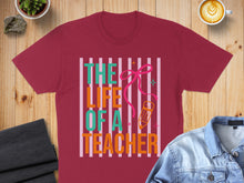 Load image into Gallery viewer, Burgundy t-shirt with "The Life of a Teacher" text and pencil graphic.
