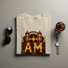 Load image into Gallery viewer, Cream t-shirt with "AM" logo featuring vintage radio tubes and microphone graphic.
