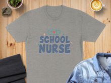 Load image into Gallery viewer, Gray t-shirt with "School Nurse" text and a band-aid graphic.
