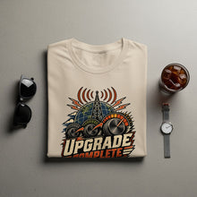 Load image into Gallery viewer, Cream t-shirt with "Upgrade Complete" text and graphic of a globe and gauges.
